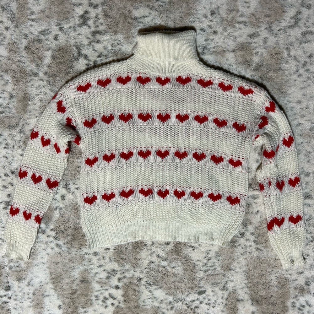 Chic White Turtleneck Sweater with Red Heart Accents